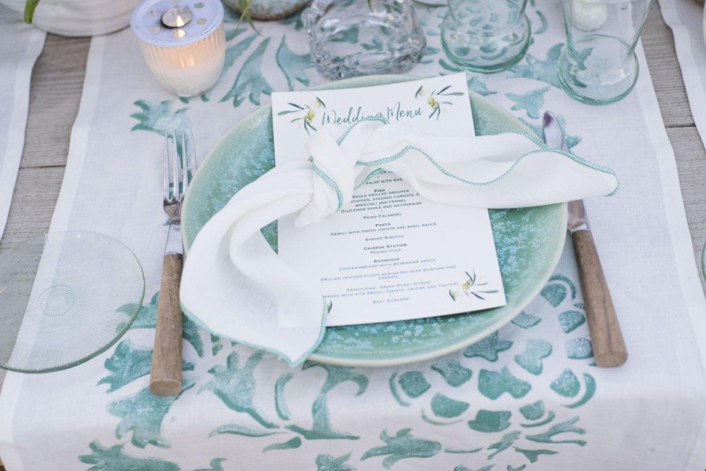 White linen napkin with green stitching - Image 1